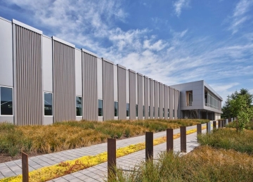 Metal Commercial Building with small windows. and Corrugated panels