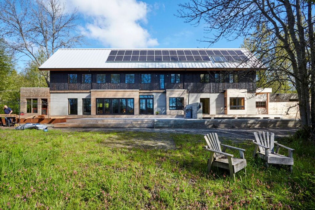 Residential home with metal roof and solar panels. 